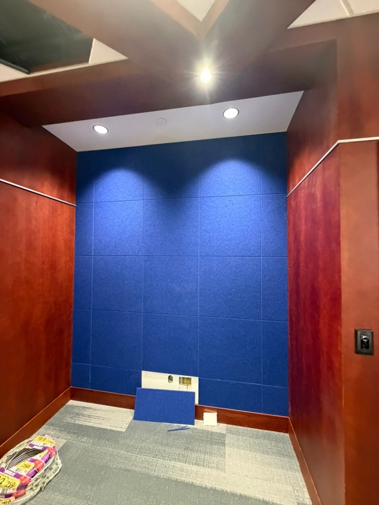 Architectural acoustic treatment installed in a meeting space